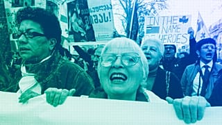 A woman shouts as other protestors march outside the parliament building in protest of "the Russian law" in Tbilisi, April 2024