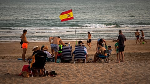 Bathers enjoy the beach in Barbate in southern Spain's Cadiz province.