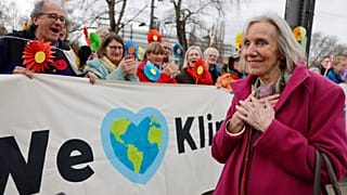 Switzerland's Rosmarie Wilder-Walti reacts as Swiss retirees demonstrate outside the European Court of Human Rights.