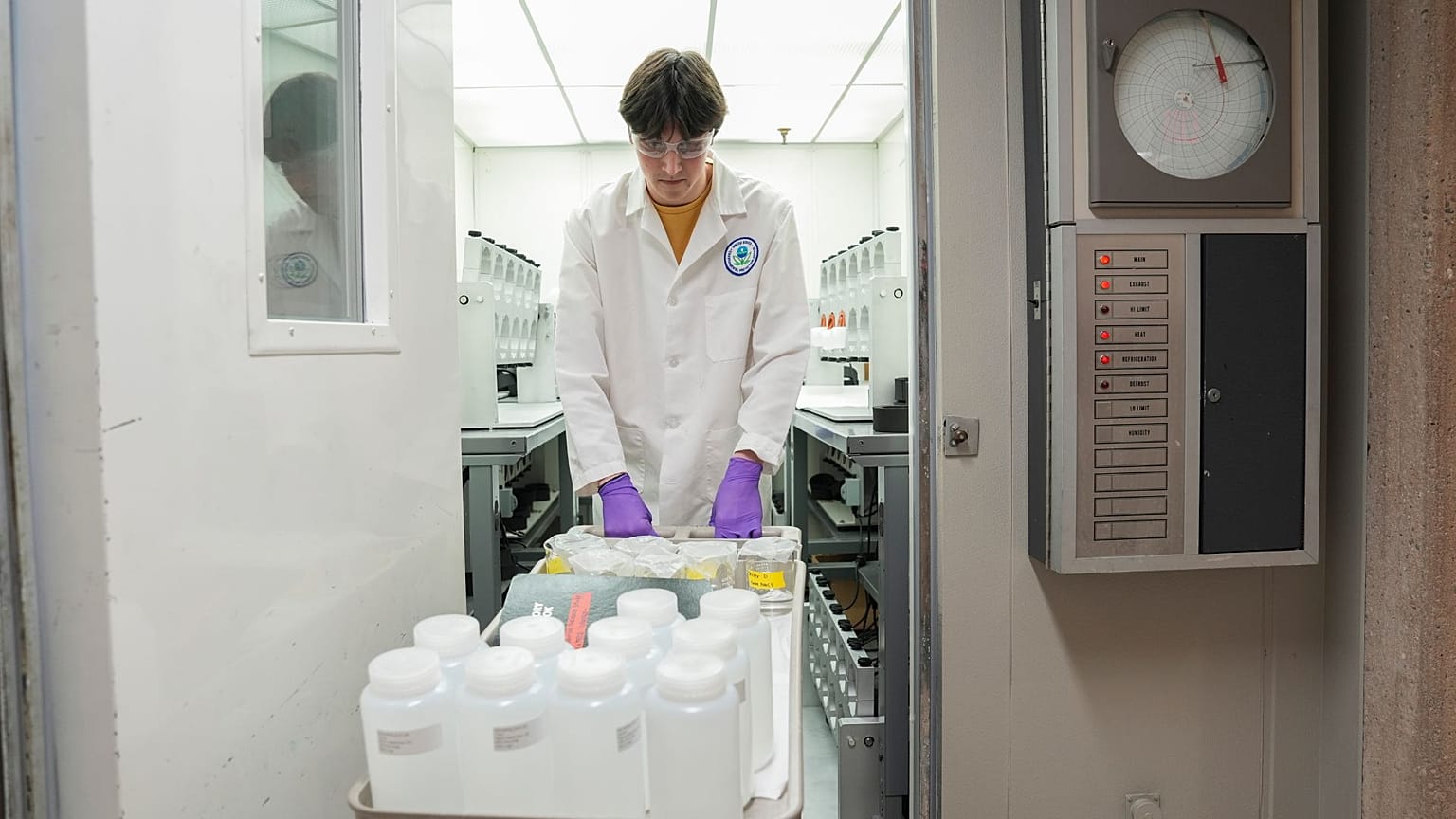 Jackson Quinn brings PFAS water samples into a temperature controlled room, 10 April 2024, at a US Environmental Protection Agency lab in Cincinnati.