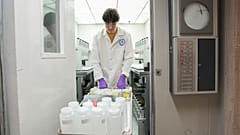 Jackson Quinn brings PFAS water samples into a temperature controlled room, 10 April 2024, at a US Environmental Protection Agency lab in Cincinnati.
