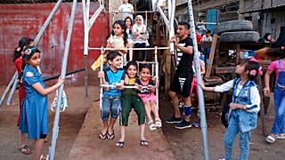 Children enjoy a ride during Eid al- Fitr celebrations, that marks the end of the Muslim holy fasting month of Ramadan, in the Fadhil neighborhood or Baghdad, Iraq, Wedsnday.