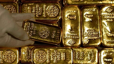 Employees of ProAurum gold house prepares 0.5 Kg gold bars of 999.9 purity in the safe deposit boxes room in Munich, Germany, Thursday, Dec. 13, 2018. 