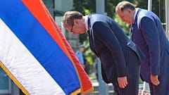Serbian President Aleksandar Vucic, center, reviews the honour guard with Bosnian Serb leader Milorad Dodik during a welcome ceremony in Banja Luka, northern Bosnia