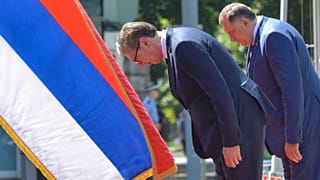 Serbian President Aleksandar Vucic, center, reviews the honour guard with Bosnian Serb leader Milorad Dodik during a welcome ceremony in Banja Luka, northern Bosnia