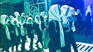 Students walk together from school in Kabul, June 2023