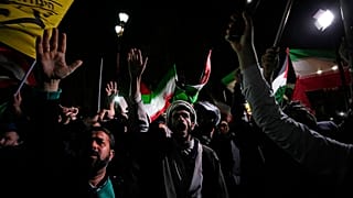 Iranian demonstrators chant slogans during an anti-Israeli gathering in front of the British Embassy in Tehran, Iran, early Sunday, April 14, 2024.