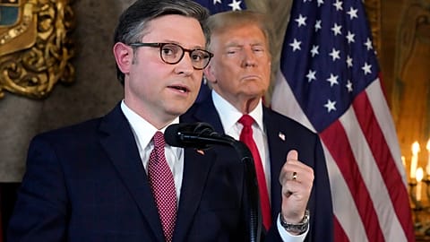 Speaker of the House Mike Johnson speaks as Republican presidential candidate former President Donald Trump listens during a news conference
