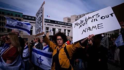 People take part in a demonstration of solidarity with Israel in Berlin, Sunday, April 14, 2024 following the Iranian attacks on Israel overnight.