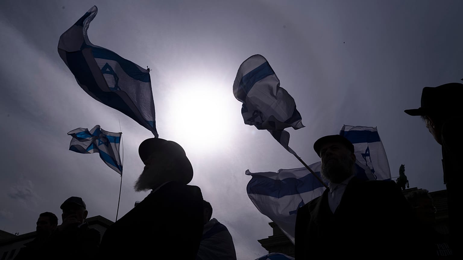 FILE - People take part in a demonstration of solidarity with Israel in Berlin, Sunday, April 14, 2024 following the Iranian attacks on Israel overnight.