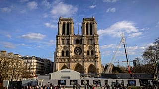 Scaffolding is being removed around the spire of Notre Dame de Paris cathedral, showing the rooster and the cross, in Paris, France, Saturday, Feb. 17, 2024.