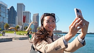Contented content creator Cynthia Huang Wang works along the Embarcadero in San Francisco, Monday, April 8, 2024.