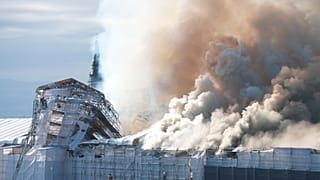 Smoke rise out of the Old Stock Exchange, Boersen, in Copenhagen, Denmark, Tuesday, April 16, 2024.