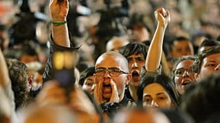 Protestors shout as they gather outside the parliament building in Tbilisi, Georgia, on Monday, April 15, 2024.