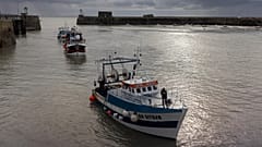 French trawlers arrive in the port of Granville, Normandy, after fishing.