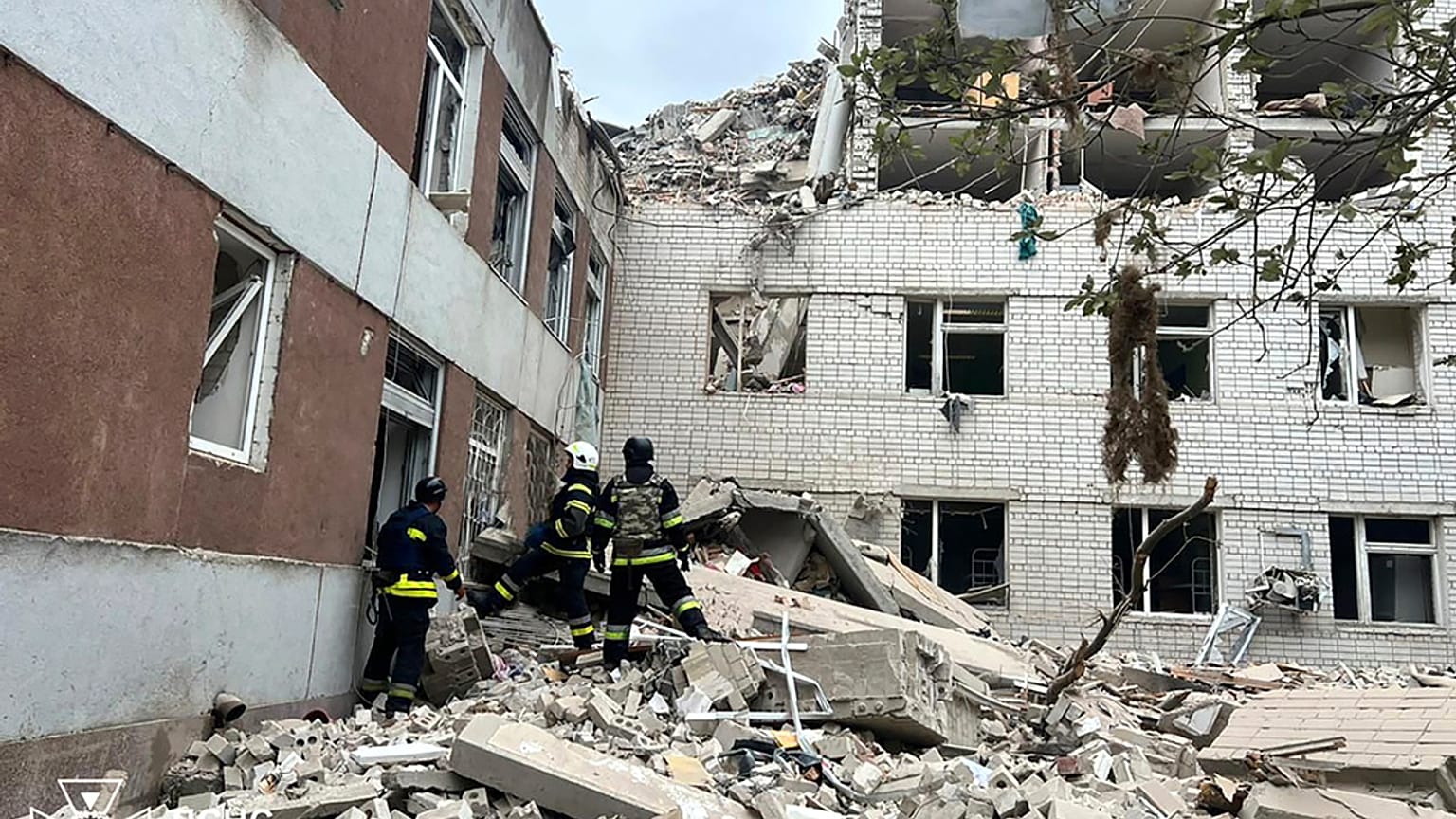 In this photo provided by the Ukrainian Emergency Service, rescuers work at the site of a Russian missile strike in Chernihiv, Ukraine, Wednesday, April 17, 2024.