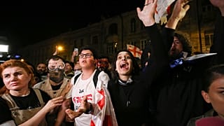 Demonstrator shouts during a rally outside the parliament building in Tbilisi, Georgia, on Thursday, April 18, 2024, to protest against "the Russian law"