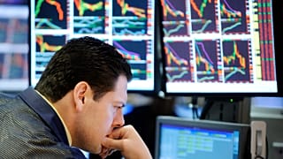 File photo of a trader studying the markets
