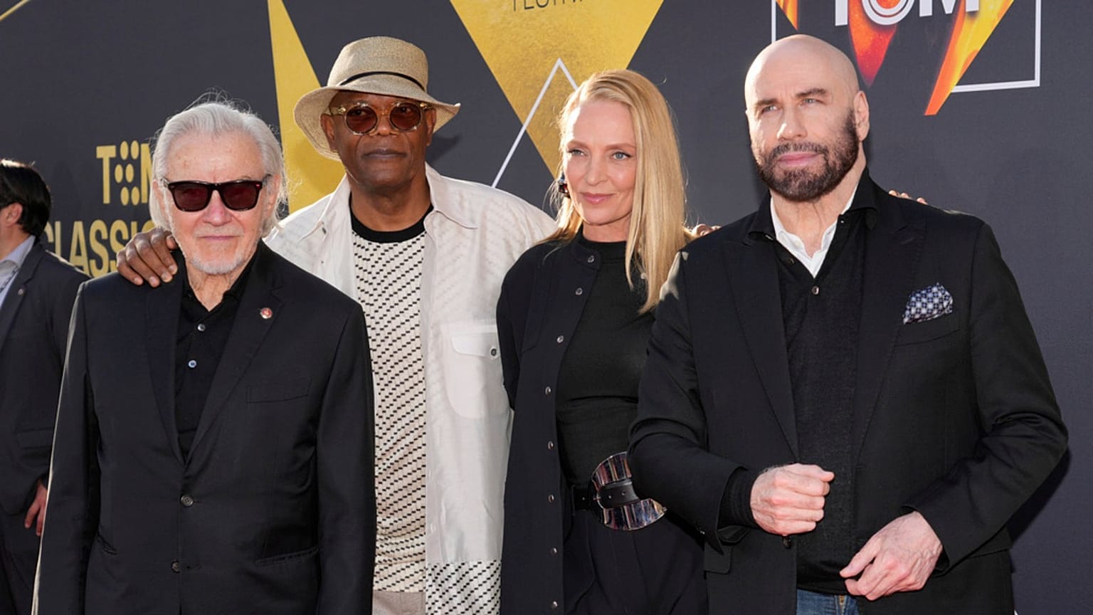 Harvey Keitel, Samuel L. Jackson, Uma Thurman, and John Travolta, stars of "Pulp Fiction," pose at the film's 30th anniversary screening during the TCM Classic Film Festival