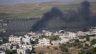 Smoke fills the sky after Israeli settlers set fire to the properties of Palestinian villagers in the West Bank village of al-Mughayyir, Saturday, April 13, 2024. 