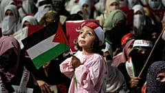 Supporters of the religious party Jamaat-e-Islami take part in a rally against Israeli airstrikes on Gaza and to show solidarity with the Palestinians, in Lahore, Pakistan