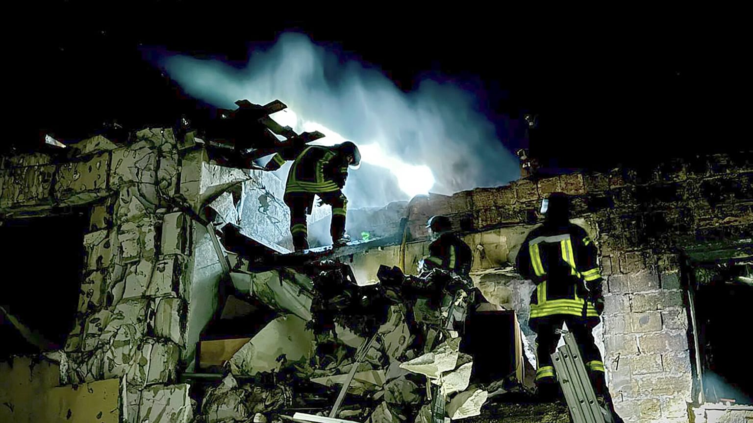 Firefighters work on the site of a burning building after a Russian drone attack in Odesa, Ukraine.