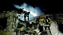 Firefighters work on the site of a burning building after a Russian drone attack in Odesa, Ukraine.