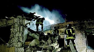 Firefighters work on the site of a burning building after a Russian drone attack in Odesa, Ukraine.