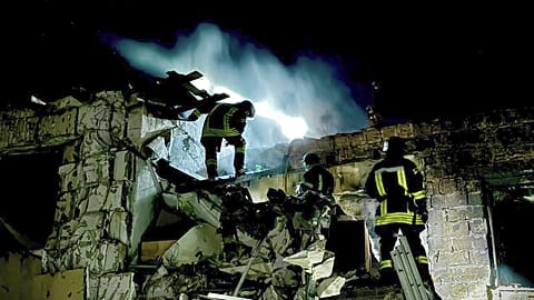 Firefighters work on the site of a burning building after a Russian drone attack in Odesa, Ukraine.