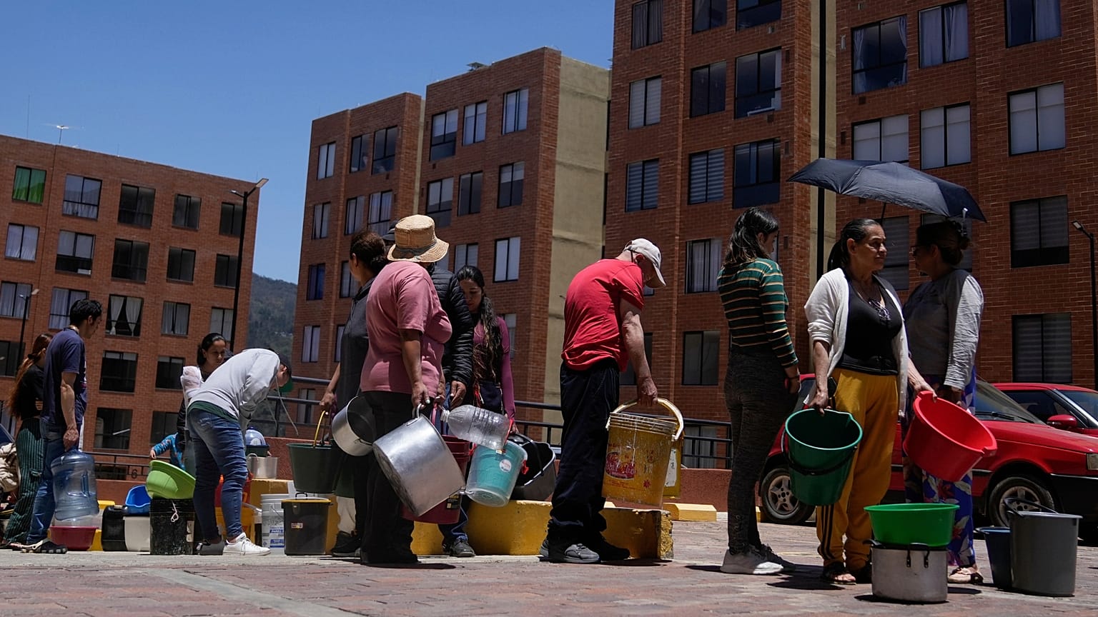 Residents line up to collect water from a truck during water rationing in La Calera, on the outskirts of Bogota, Colombia.