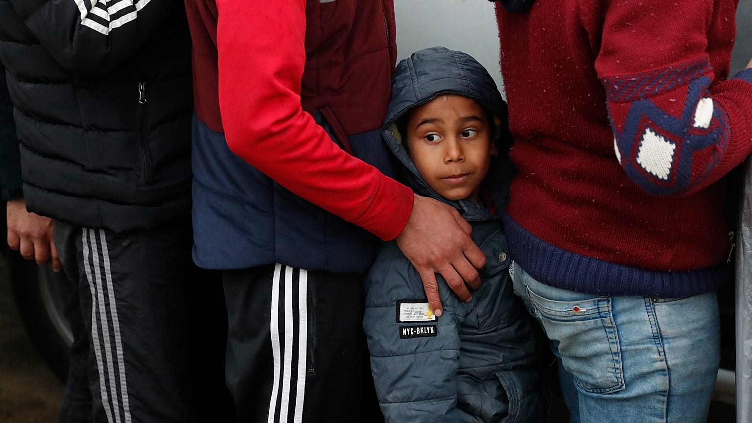 Migrants wait in line for blankets close to the Turkish-Greek border.