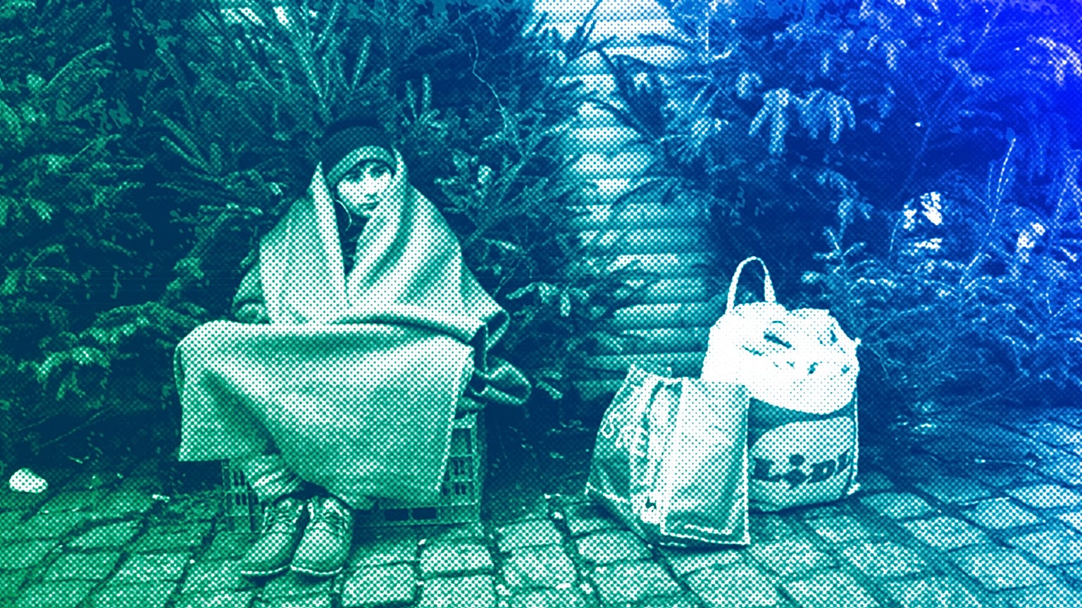 A person camps outside the city hall of Mons, December 2013