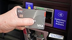 A customer uses the contactless payment chip in their Visa card to purchase gasoline at a station in Ridgeland, Miss., Thursday, July 1, 2021. 