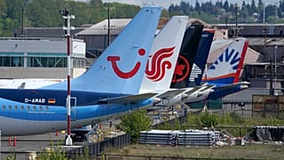 Boeing 737 Max airplanes, including one belonging to TUI Group, parked at a storage lot near Boeing Field in Seattle. April 26, 2021.