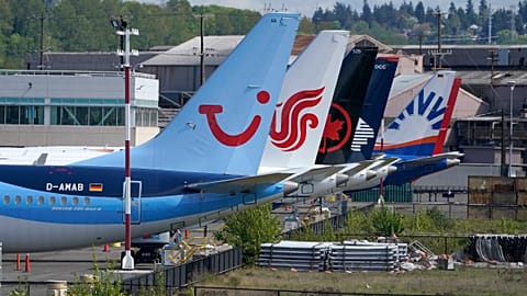 Boeing 737 Max airplanes, including one belonging to TUI Group, parked at a storage lot near Boeing Field in Seattle. April 26, 2021.