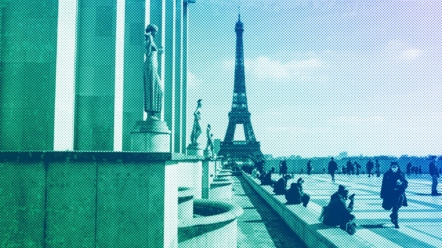 People walk near the Eiffel Tower in Paris, March 2021