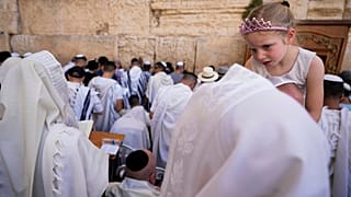 Covered in prayer shawls, Jewish men of the Cohanim Priestly caste participate in a blessing Jerusalem's Old City, Thursday, April 25, 2024.