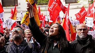 Supporters of Spain's prime minister Pedro Sanchez gather at the PSOE party headquarter during a demonstration in Madrid, Spain, Saturday, April 27, 2024.