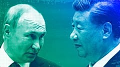 Russian President Vladimir Putin speaks to Chinese President Xi Jinping during the Shanghai Cooperation Organization (SCO) summit in Samarkand, September 2022