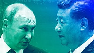 Russian President Vladimir Putin speaks to Chinese President Xi Jinping during the Shanghai Cooperation Organization (SCO) summit in Samarkand, September 2022