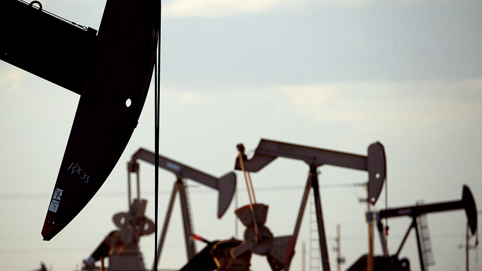 Pump jacks work in a field near Lovington, New Mexico in this file photo