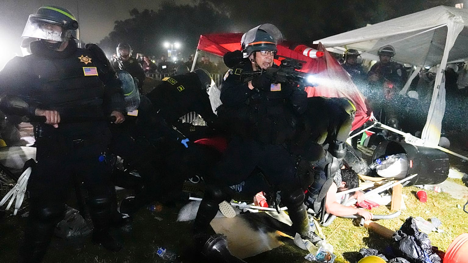 Police advance on pro-Palestinian demonstrators in an encampment on the UCLA campus Thursday, May 2, 2024, in Los Angeles.
