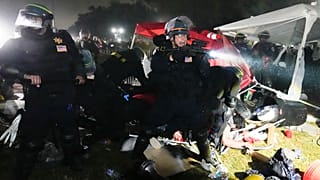 Police advance on pro-Palestinian demonstrators in an encampment on the UCLA campus Thursday, May 2, 2024, in Los Angeles.