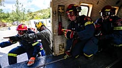 Firefighters of the 1st Wildfire Special Operation Unit take part in a drill in Villia village, 60 kilometres northwest of Athens, Greece, 19 April 2024. 