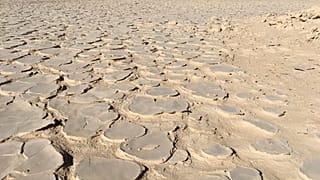 The desert landscape of the Yungay Playas with the typical pattern of parched ground.