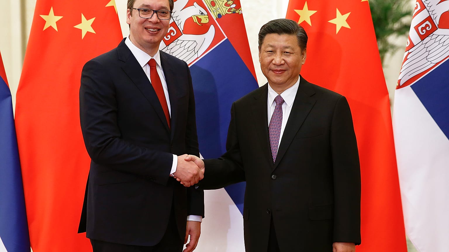 Serbian Prime Minister Aleksandar Vucic, left, and Chinese President Xi Jinping pose for photographers as they meet in Beijing Tuesday, May 16, 2017.