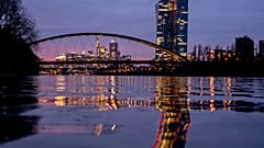 The European Central Bank is reflected in the River Main in Frankfurt.