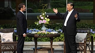 Chinese President Xi Jinping, right, and France's President Emmanuel Macron at the Guandong province governor's residence in Guangzhou, China. April 7, 2023.