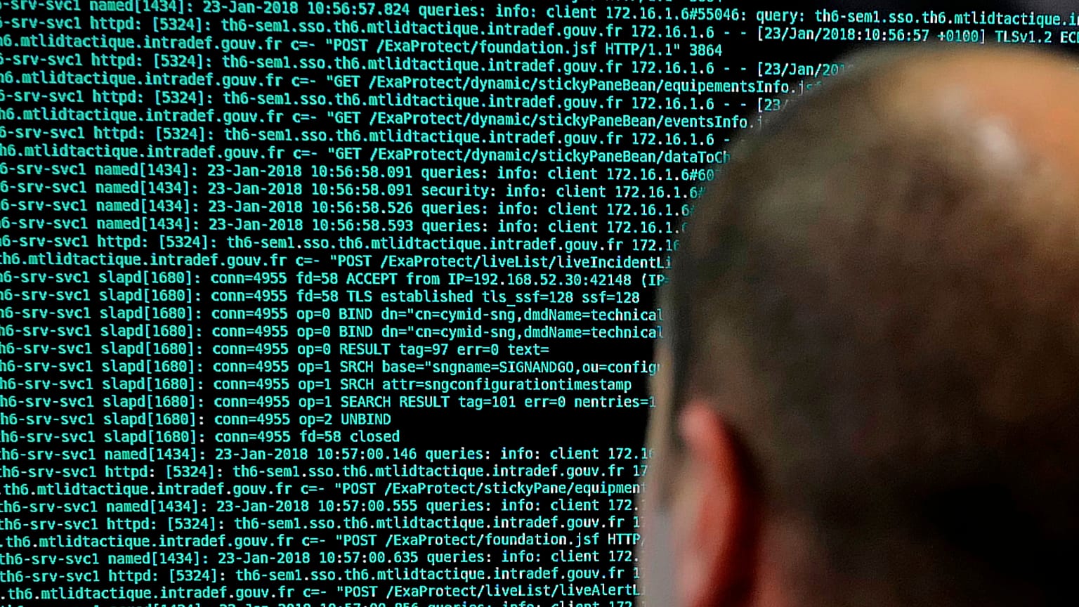A French solider watches code lines on his computer at the French Defense ministry stand during the International Cybersecurity forum in Lille.
