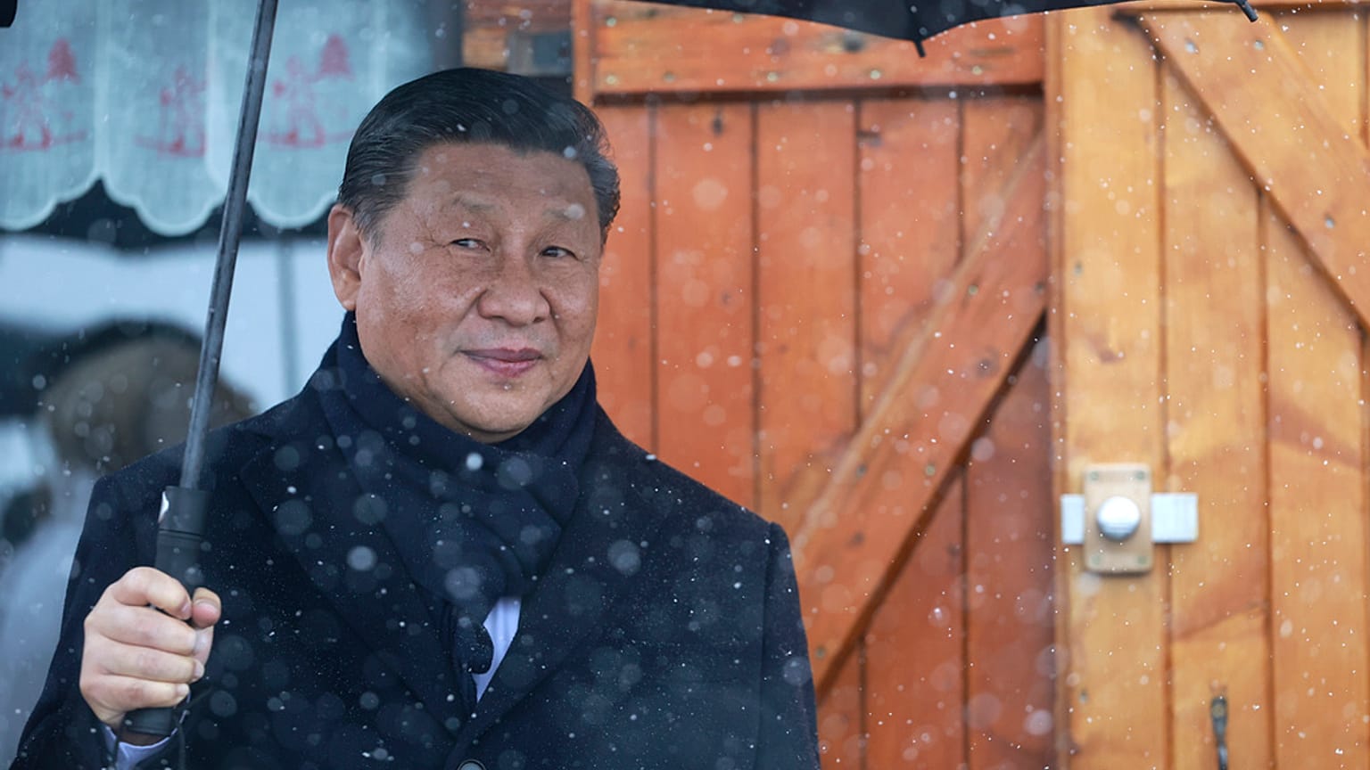 Chinese President Xi Jinping holds an umbrella outside a restaurant Tuesday, May 7, 2024 at the Tourmalet pass, in the Pyrenees mountains. 
